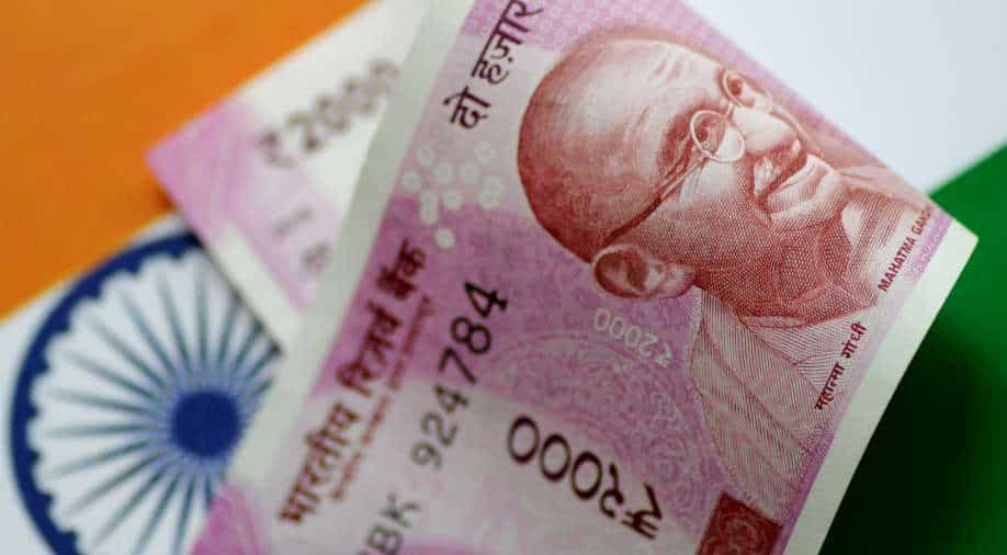 Rupee hits file low of 82 against US dollar as OPEC+ conception manufacturing lower