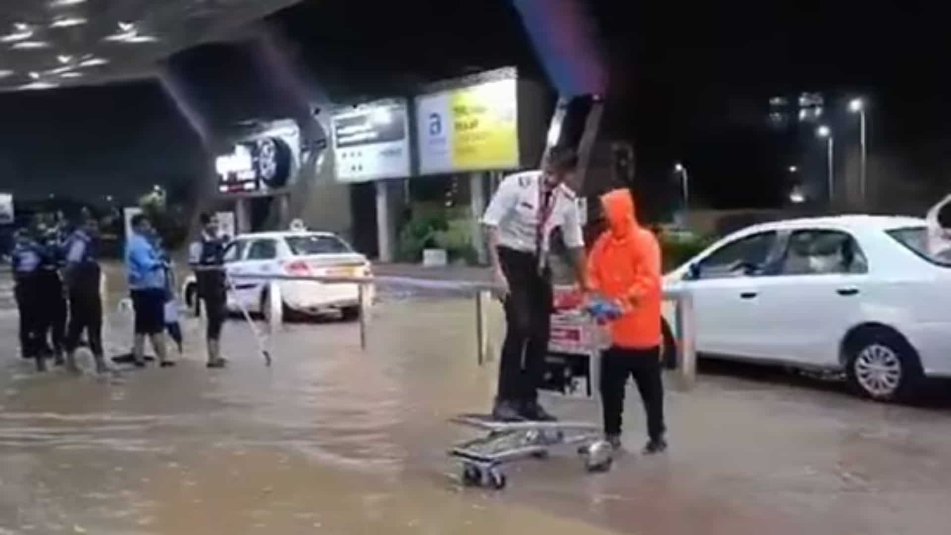 India rains: Pilot rides luggage cart by technique of flooded Jaipur airport | See